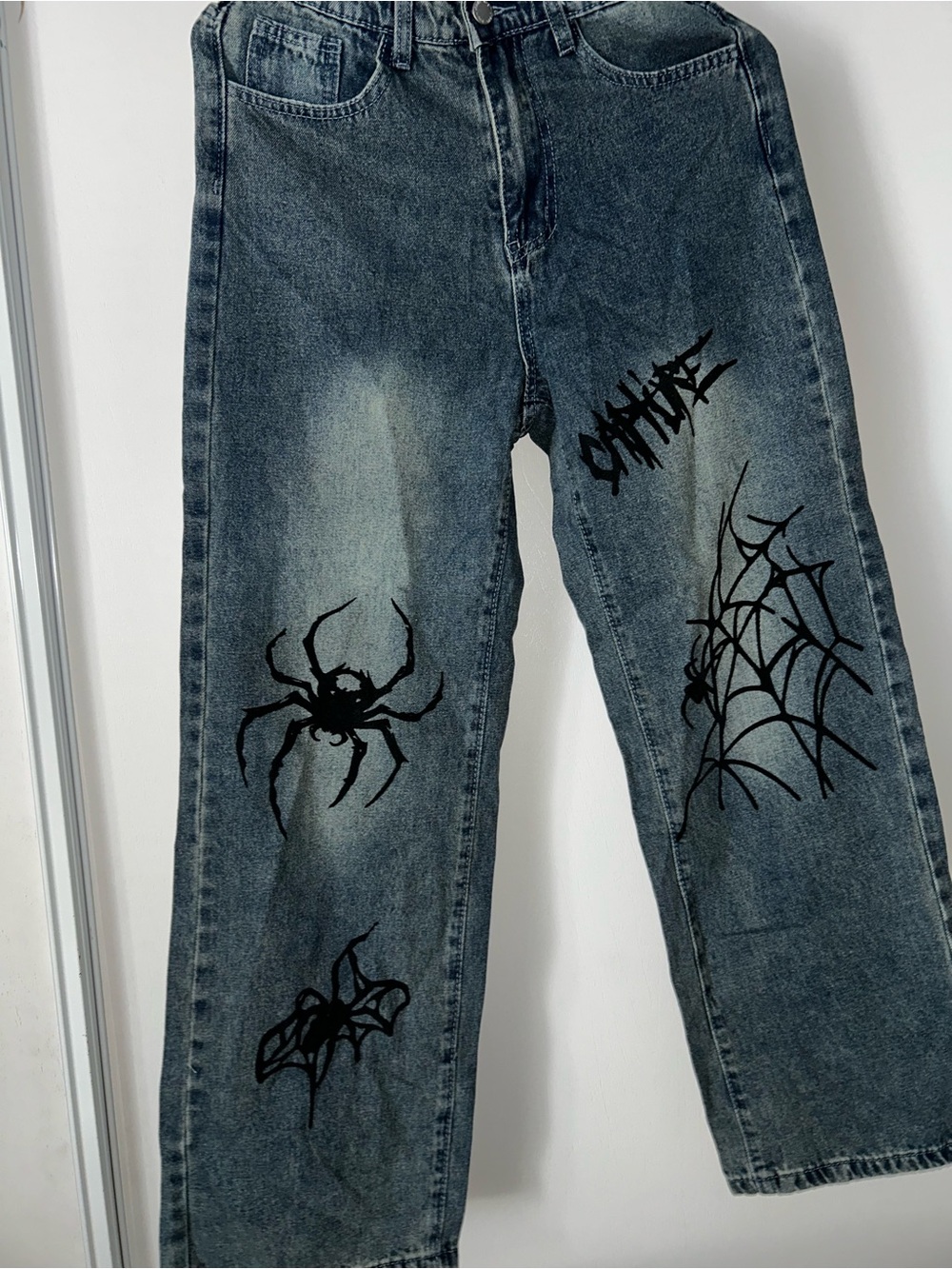 SHEIN Blue Washed Denim Jeans with Black Spider & Web Graphics